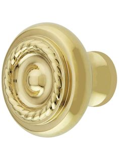 an image of a door knob with braided rope on the outside and brass finish