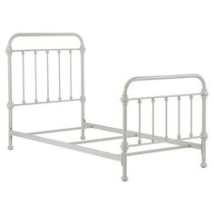 a white metal bed frame with no headboard