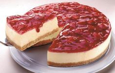 a cheesecake on a plate with a slice cut out