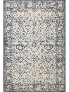 a blue and white rug with an ornate design