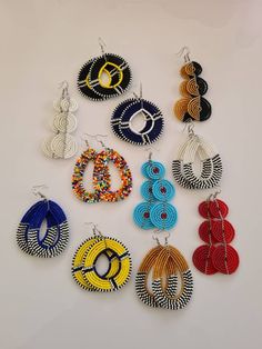 This listing is for ALL 11 pairs. The earrings are 100% handmade using original fine beads. Colorful and bright colors. ^^These earrings ships through dhl express.  More earrings; https://www.etsy.com/shop/TribalTess?ref=seller-platform-mcnav&section_id=21293980 Buy multiple items and pay shipping for ONE item ONLY. Traditional Multicolor Earrings With Polished Beads, African Jewelry Earrings, African Earrings, Aso Oke, Fabric Earrings, Handmade Beaded Necklaces, Handmade African, Maasai, African Beads