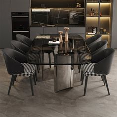 a dining room table with black chairs and an oven in the backround area