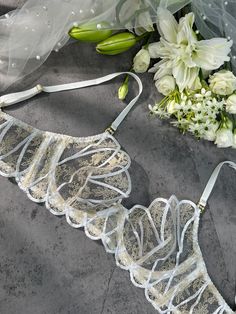 Introducing "Heavenly Glow Radiance Luxe Lingerie Set," a celestial blend of white satin and golden thread embroidery, creating an ethereal lingerie experience. Elevate your moments with the divine touch of opulence. ✨ ✨ Material: Made of 90% Polyester, 10% Elastane. Exquisite Embroidery Design: The lingerie set features intricate embroidery, adding delicate patterns for an alluring appeal. Comfortable and Form-Fitting: Lightweight Padded-free Underwire Bra. Crafted from soft and smooth fabric, this lingerie set offers a comfortable and flattering fit. Adjustable Straps: The bra and panties come with adjustable straps, allowing you to customize the fit to suit your body shape perfectly. Quality Assurance: We pay meticulous attention to every detail, ensuring top-notch quality lingerie that Golden Thread Embroidery, Golden Thread, Gold Luxury, La Girl, Lace Lingerie Set, Red Lingerie, Thread Embroidery, Green Accents, Spring Sale