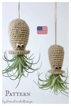 two crocheted octopus ornaments hanging from strings with an american flag in the background