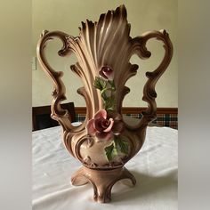 a decorative vase is sitting on a table