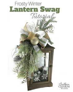 the front cover of frosty winter lanterner swag with evergreen and pine cones