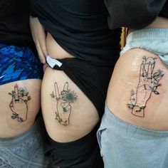 two women with tattoos on their butts