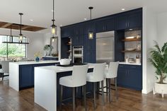 a kitchen with blue cabinets and white chairs