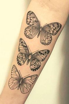 three butterflies tattoo on the arm