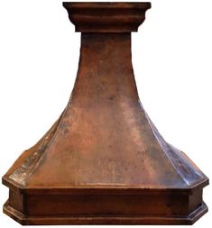 an old fashioned copper colored stove hood on a white background