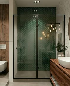 a bathroom with a sink, mirror and shower stall in the middle of the room