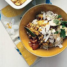 two bowls filled with food on top of a table