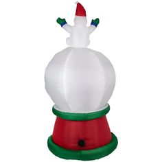 an inflatable snowman sitting on top of a red and green cone shaped object