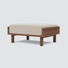 the footstool is made out of wood and fabric