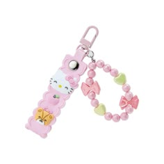 a pink hello kitty cell phone charm with beads and charms on it's side