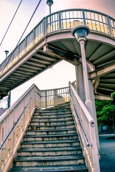 a set of stairs leading up to an overpass