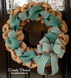 a burlock wreath with blue and white chevrons on the front door