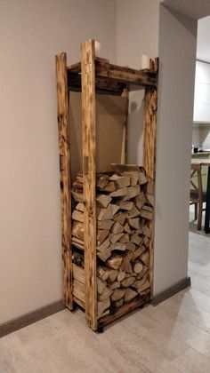 a stack of firewood sitting in the corner of a room