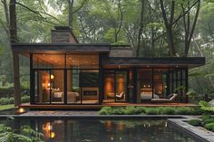 a house in the middle of a lush green forest with a pool and patio area