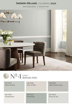 a dining room table and chairs with gray walls