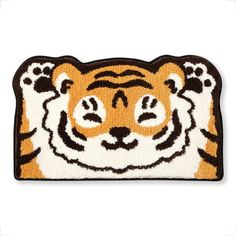 a door mat with a tiger face on the front and side of it's head