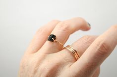 A stunning piece of Raw Black Tourmaline is showcased in a custom built, 14K Gold Fill prong setting. This piece - while delicate in design - makes a bold statement through the contrast of the bright metal against the deep black of the tourmaline stone. Raw Black Tourmaline, Tourmaline Stone, Gold Filled Ring, Deep Black, Black Tourmaline, The Deep, In Design, Prong Setting, Sapphire Ring