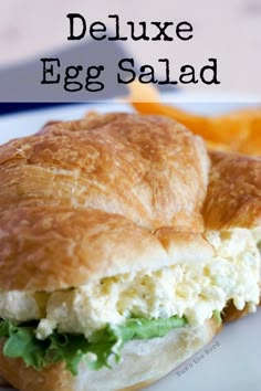 an egg salad sandwich on a white plate