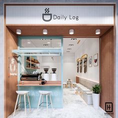 the inside of a coffee shop with stools