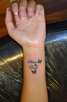 a woman's arm with a tattoo on it that says mom, i do