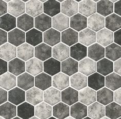 a black and white hexagonal tile pattern with grey grungy paint on it