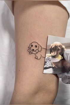 a dog with a bone in it's mouth is shown on the side of a woman's thigh