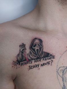 a man with a tattoo on his chest saying what's your favorite scary movie?