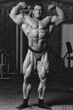 a man posing for the camera in his garage