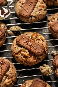 chocolate chip cookies with peanut butter and walnuts on a cooling rack