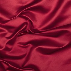 Mood's Premium Roja Red Silk Duchesse Satin is as regal as silk fabric gets. Its riveting understated sheen, medium weight and firm hand make for elegant special occasion wear. Available in 25+ attractive shades. 

Note: Dye lots are subject to change up to 10% in either direction. Ordering swatches is HIGHLY recommended for these products. Red Satin Fabric, Satin Curtains, Bridesmaid Attire, Duchess Satin, Club Color, Mood Fabrics, Satin Saree, Luxury Silk, Silk Charmeuse