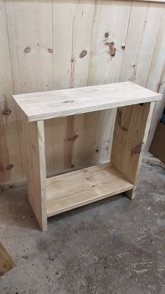 a wooden shelf sitting on top of a floor