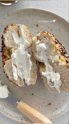 a white plate topped with two pieces of bread covered in cream