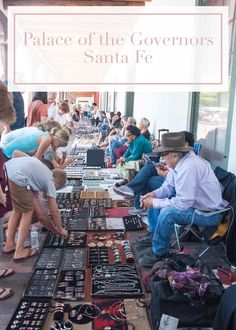 people are looking at items on display in a store window that says palace of the governments santa fe