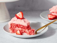 there is a piece of cake with strawberries on it and a fork in the plate