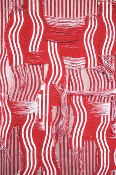 red and white striped fabric with fringes on the edges, in an abstract manner