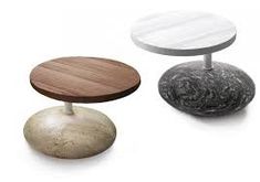 three round tables with different colors and designs on them, one is made out of concrete and the other has a wood top