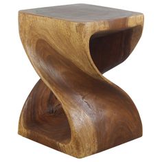 a wooden table with an unusual design on it's side and the top section is made out of wood