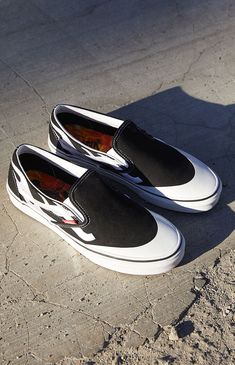 A$AP Worldwide and Vans come together to bring the Black & White Classic Slip-On Shoes to your fire fit. The classic low-profile shoes have traditional Vans comfort and get updated with flames graphics at the sides. PLEASE NOTE: This shoe is offered in Men's sizes; please consult the Size Chart above - the conversion is a size and a half smaller for women. For example, a woman who is a size 7.5 should order a size 6 in Men's. Solid canvas upper Flames graphics Low profile slip-on shoes Vans Mens Slip On Shoes, Slipon Shoes, Vans Logo, Shoes Vans, Sport Shoes Men, Skate Wear, Fire Fits, Aesthetic Shoes, Vans Shop