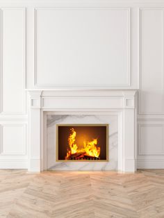 a fire place in a white room with wood flooring