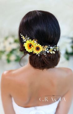 a woman with sunflowers in her hair wearing a bridal headpiece for the bride