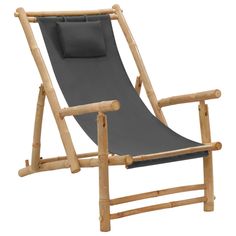 a chair made out of bamboo and grey fabric with a pillow on the backrest