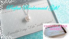 the bridesmaid gift box has a necklace with a pearl on it and a card inside