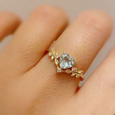 Cue the romance with our stunning Heart’s Desire Aquamarine Ring. This perfect expression of true love features a heart-shaped aquamarine center stone along with a curved white topaz leafy band that adds a natural charm. A cherished keepsake that radiates love from every angle. ✦ Available in both 14K yellow gold vermeil (14K yellow gold plated over a sterling silver base) and 10K solid yellow gold. Aquamarine Heart Ring, Engament Rings, Expression Of Love, Heart Wedding Rings, Heart Promise Rings, Promise Ring For Her, Cute Engagement Rings, Gold Promise Rings, Sibling Rivalry