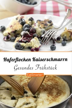 a pancake with blueberries and cream is being eaten by a spatula on a plate