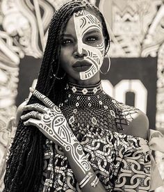 an image of a woman with face paint on her face and the caption below